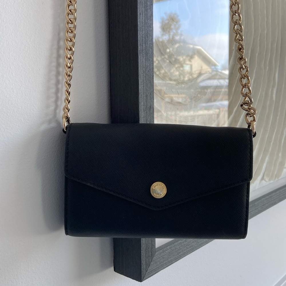 Mini black Michael Kors bag with gold chain strap